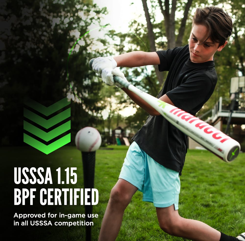 A boy swings a 2024 Marucci CATX SMART (-5) 2 3/4" USSSA Baseball Bat (MSBCXS5) at the plate, showcasing his skills with this top-rated Marucci bat.