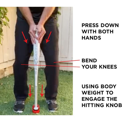 On grass, a person grips a bat with both hands, knees bent, pressing down to engage the Hitting Knob Bat Weight by Hitting Knob—an aid that improves bat speed. Directions emphasize hand placement, knee bend, and using body weight.