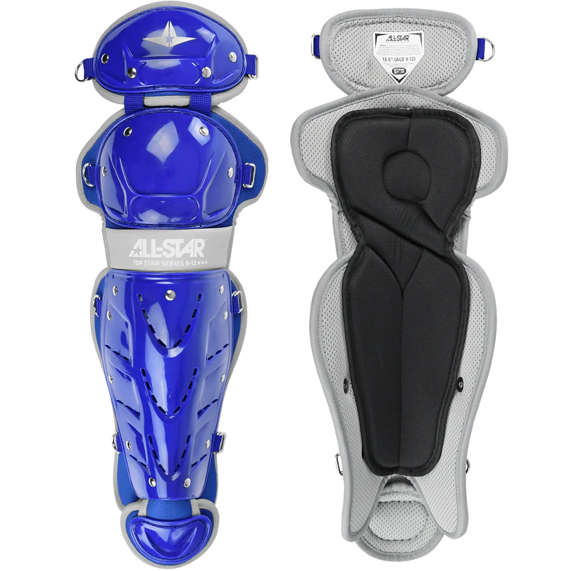 Two All Star Top Star Catcher's Leg Guards (LG-TS) are shown: the left displays a shiny blue and silver shell, while the right shows the soft, padded gray and black interior. Double-knee design enhances protection for youth players.