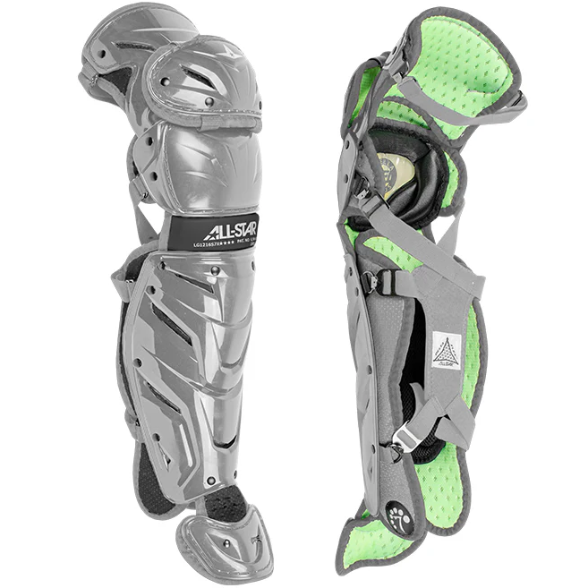 Two gray All Star System7 Axis Catcher's Leg Guards, featuring lime green padded lining and a LINQ hinge system for mobility, are shown: one displays the hard shell, the other the inner padding and adjustable straps.