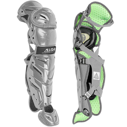 Two gray All Star System7 Axis Catcher's Leg Guards, featuring lime green padded lining and a LINQ hinge system for mobility, are shown: one displays the hard shell, the other the inner padding and adjustable straps.