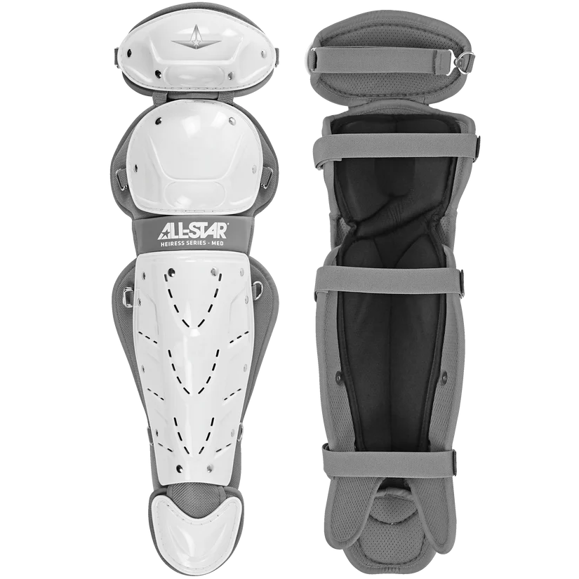 The All Star Heiress Fastpitch Catcher's Kit: CKW-H includes two white and gray shin guards—one showing the outer shell with the All Star logo, the other displaying the padded interior and straps—perfect for travel ball or a complete catcher set.