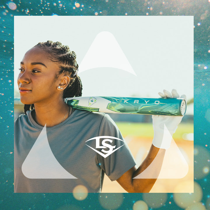 A woman in a gray shirt and white gloves holds a green and white baseball bat on her shoulder, standing outdoors with a focused expression. A stylized “LS” logo is overlaid on the image.