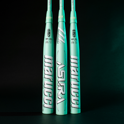 Three mint green 2025 Marucci ASURA (-9) Fastpitch Softball Bats (MFPAS9 DEMO) stand upright against a dark background, with Marucci branding and Gap Sync barrel technology clearly visible on the barrels.