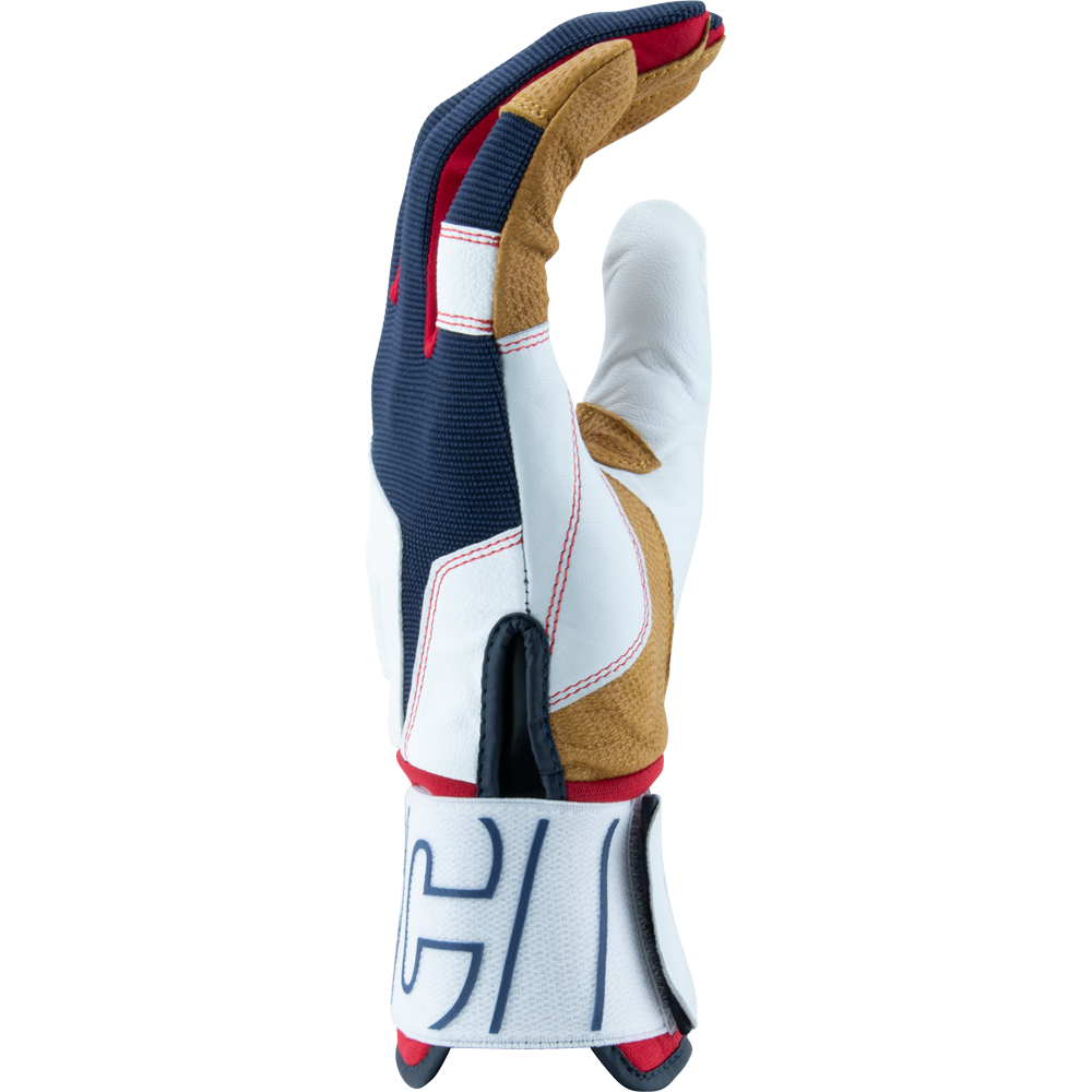 The Marucci Blacksmith V2 Full Wrap Youth Batting Glove (MBG2BKSMFWY) features a durable goatskin palm and multicolored details in white, navy blue, tan, and red, plus a white wrist strap with black lettering.