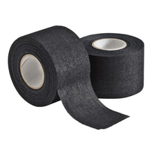Two rolls of black Mueller M Tape Athletic Tape: MTAPE, one partially unrolled cotton backcloth.