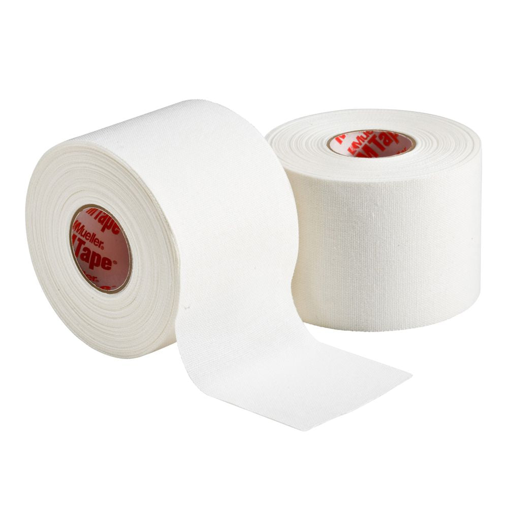 Two rolls of white Mueller M Tape Athletic Tape: MTAPE, one partially unrolled.