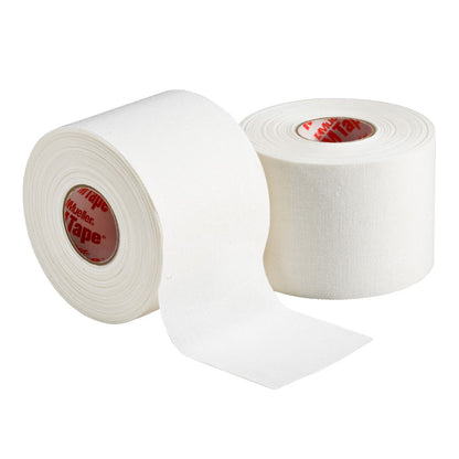 Two rolls of white Mueller M Tape Athletic Tape: MTAPE, one partially unrolled.