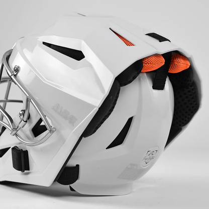 A close-up side view of the All Star PHX Paige Halstead MVP Pro Hockey Style Catcher's Helmet (MVP5-PHX) with a silver cage, black padding, and orange back ventilation inserts, shown against a plain light background.