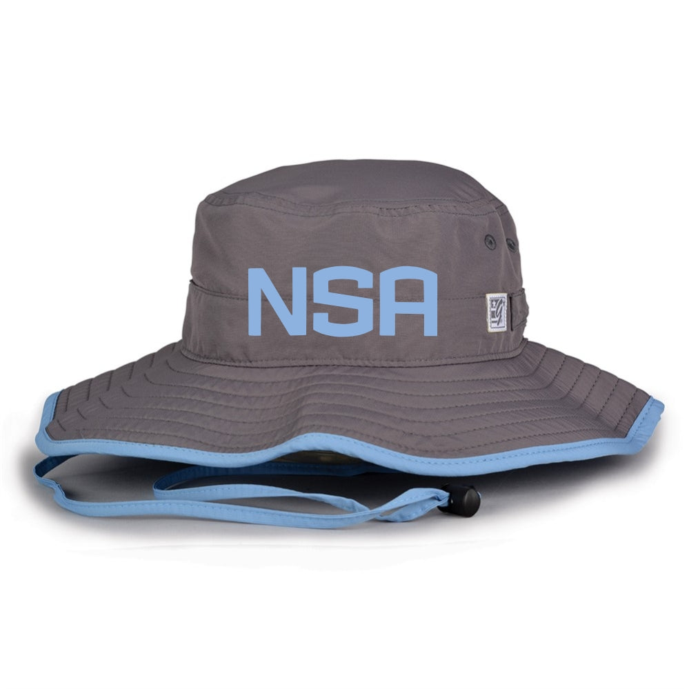 The Game Headwear NSA Classic Series Bucket Hat: GB400 is a gray bucket hat with light blue trim, bold blue NSA letters, and chin strap—ideal for sun protection at outdoor games or as a softball association hat.
