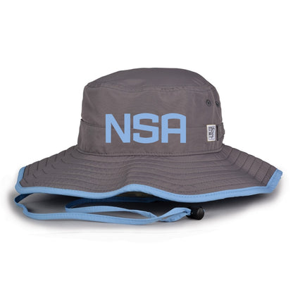 The Game Headwear NSA Classic Series Bucket Hat: GB400 is a gray bucket hat with light blue trim, bold blue NSA letters, and chin strap—ideal for sun protection at outdoor games or as a softball association hat.