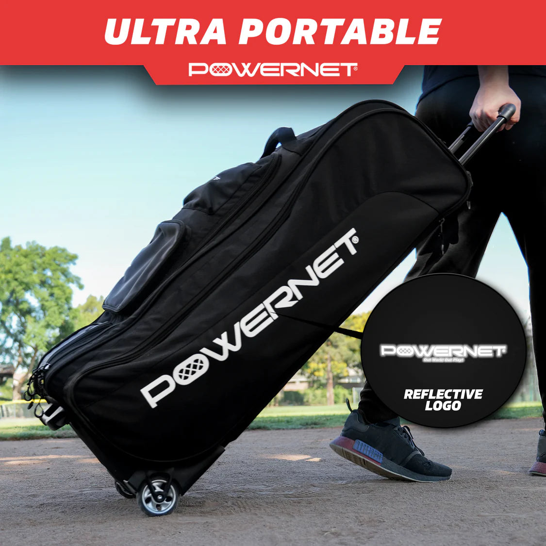 A person pulls the PowerNet Optimus Catcher's Gear Bag (B013-BK), a large black rolling bag, across a park. The PowerNet logo is displayed in white with an inset showing its reflective detail for added visibility.