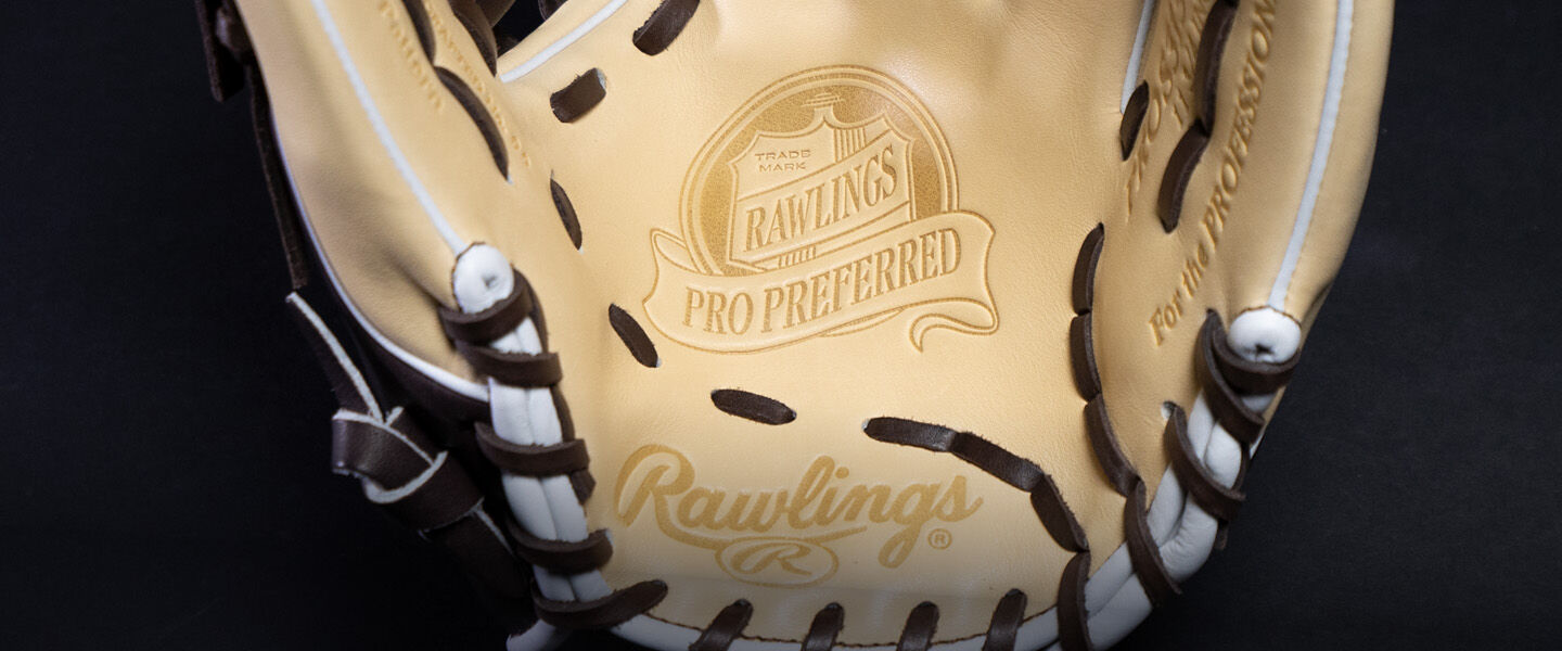 Close-up of the inside of a tan Rawlings Pro Preferred baseball glove with brown laces and visible Rawlings branding and logo on the leather.