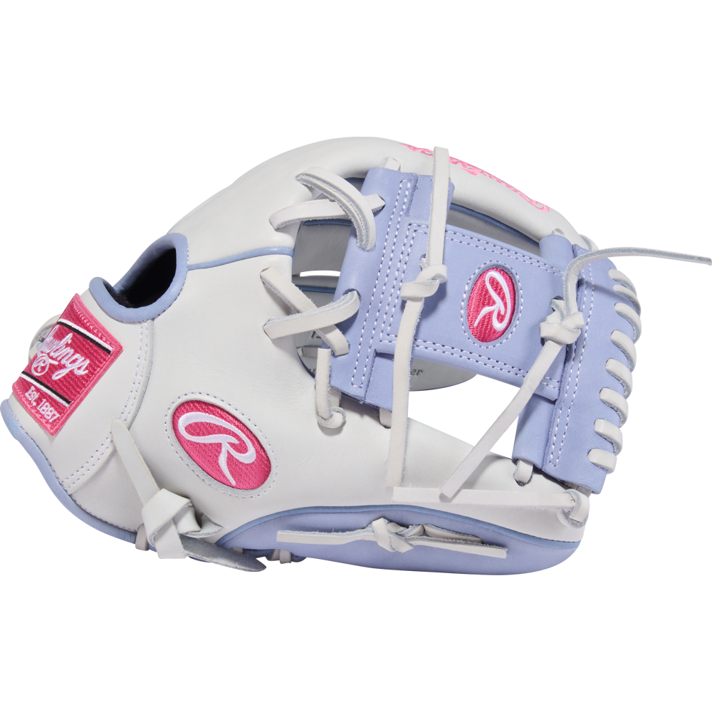 The Rawlings Liberty Advanced 12" Fastpitch Softball Glove (RLA206SB-2WPE) features a white design with lavender and pink accents, plus pink stitching on the label, laces, and webbing—a stylish utility glove from Rawlings.