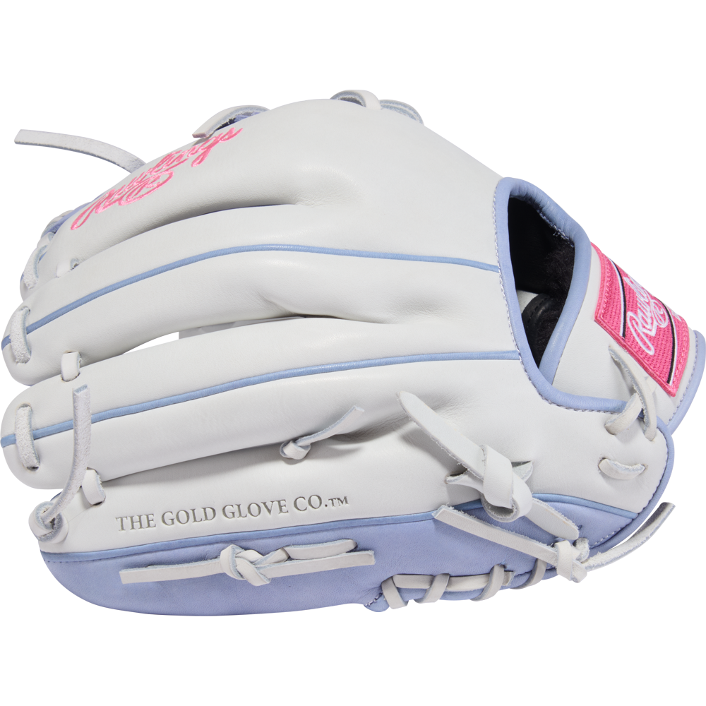 The Rawlings Liberty Advanced 12" Fastpitch Softball Glove (RLA206SB-2WPE) features a white and light blue design with pink accents, THE GOLD GLOVE CO.™ on the thumb, and is displayed against a plain white background.