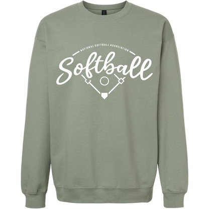 The NSA Vintage Softball Crewneck Sweatshirt by DSG Apparel features a sage green softstyle fleece and ringspun cotton blend, with "Softball" in white script above a softball field and bats graphic, plus National Softball Association text.