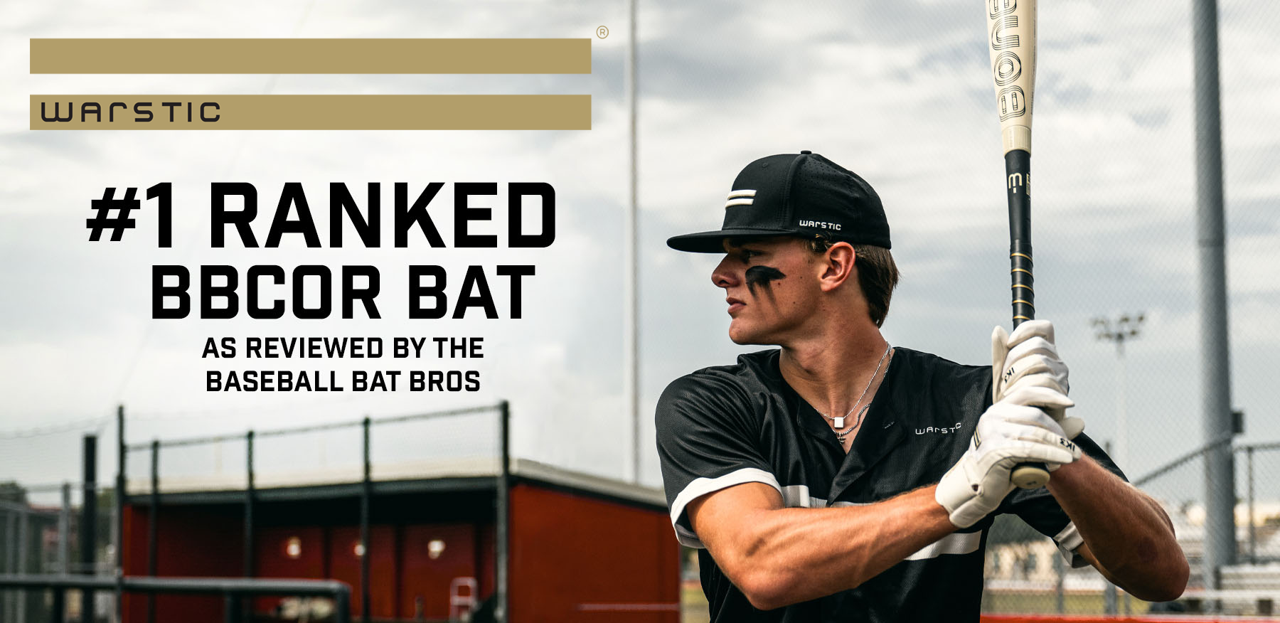 A baseball player wearing black eye black and a black jersey holds a bat, ready to swing. Text reads: “#1 Ranked BBCOR Bat as reviewed by The Baseball Bat Bros.” Warstic branding is shown above.