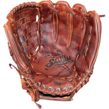 A well-worn Shoeless Joe 12" Fastpitch Glove (1200FPBW) in brown features visible stitching and the signature logo with a baseball player in the palm.