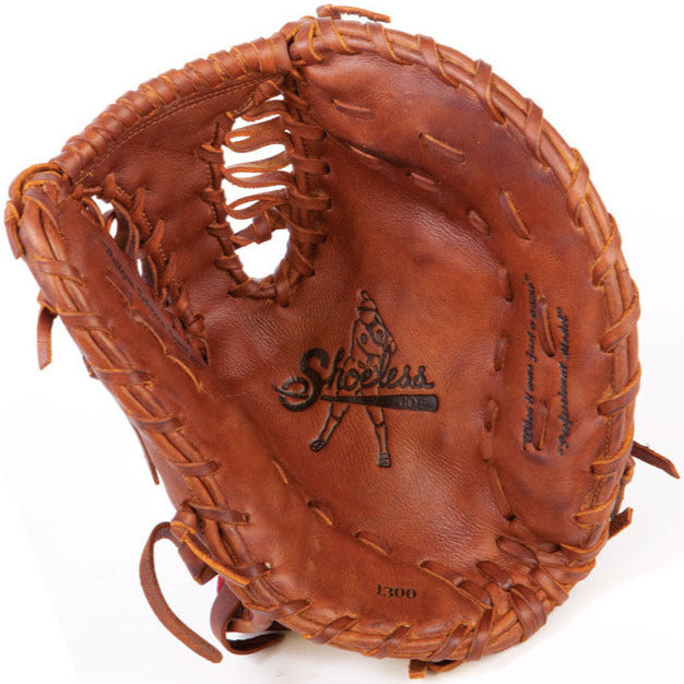 The Shoeless Joe 13" Baseball First Base Mitt (1300FBTT) is a brown leather glove with visible laces and "Shoeless Joe" stamped on the palm, ideal for players wanting a professional-quality mitt.
