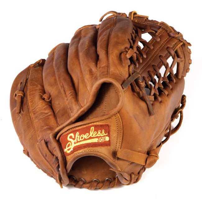 The Shoeless Joe 13" Baseball Glove: 1300MT is a brown leather outfielder's glove with visible stitching, webbed pocket, and a red and yellow Shoeless Joe logo patch sewn on the wrist.