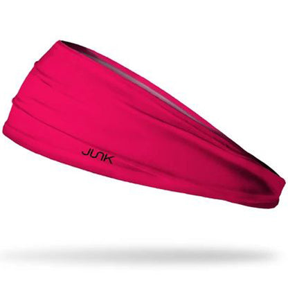 The Junk Hot Pink Headband by Junk features black text and is made from technical t-shirt fabric for excellent moisture wicking.