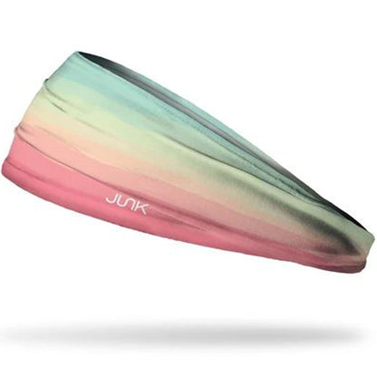The Junk Boca Headband by Junk features a multicolored gradient from teal and light green to pink, crafted from technical t-shirt fabric for superior sweat-wicking with a white JUNK logo on the side.