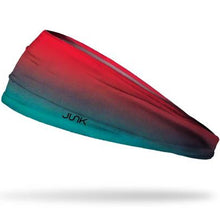 The Junk Bora Bora Headband by Junk features a gradient from red to teal and is made of moisture-wicking technical t-shirt fabric, with "JUNK" printed in black on the side.