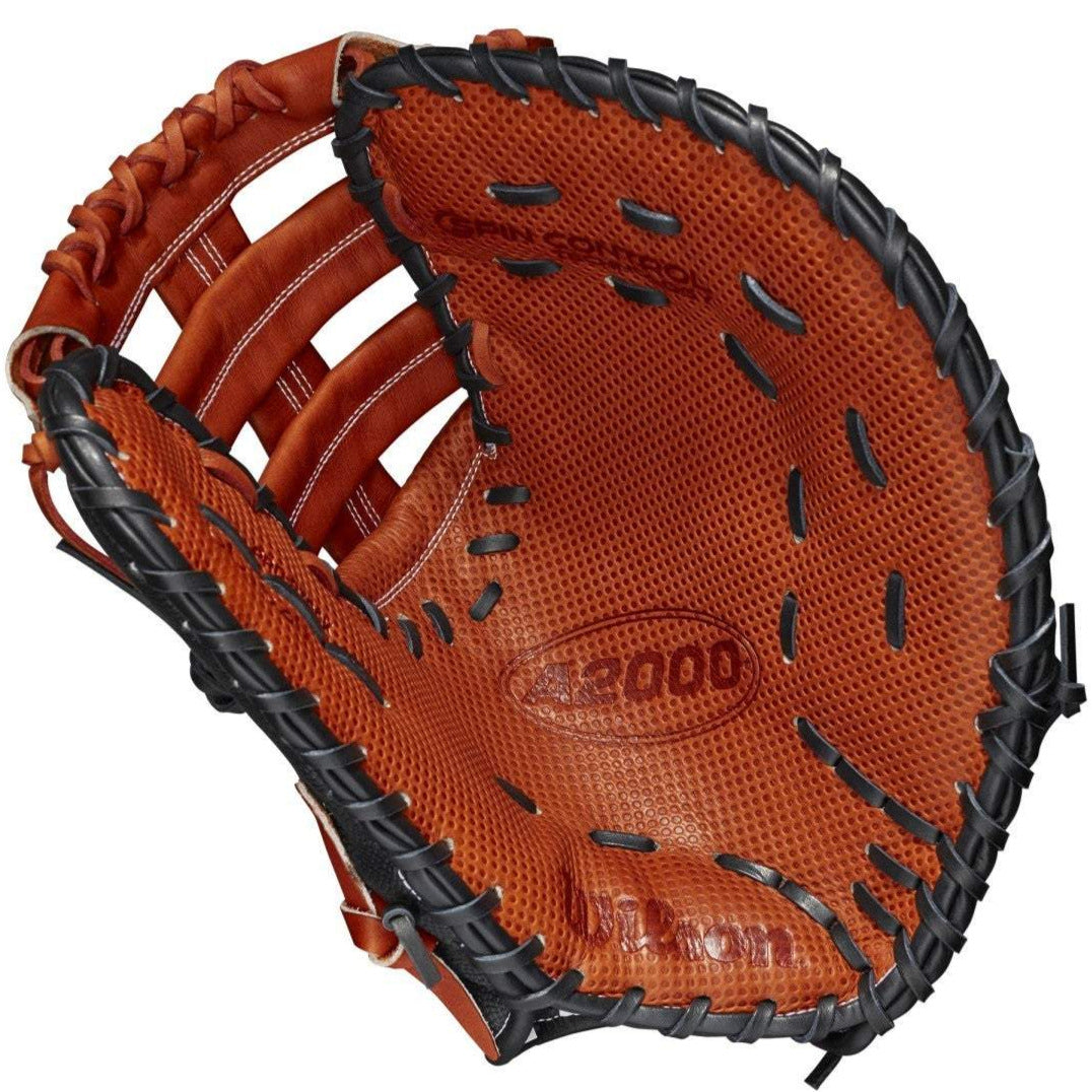 The Wilson A2000 SC1620SS 12.5" SuperSkin First Base Mitt (WBW100123125) features brown leather, black lacing, detailed stitching, SpinControl Technology, and a textured palm, shown open and facing upward.