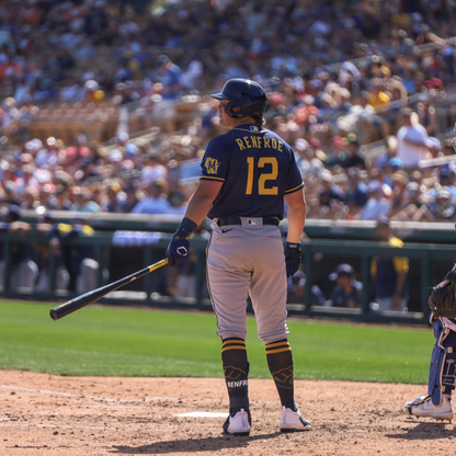 A baseball player grips a bat while wearing the EvoShield PRO-SRZ 2.0 Batter's Hand Guard (WB5726801) for enhanced protection at the plate.