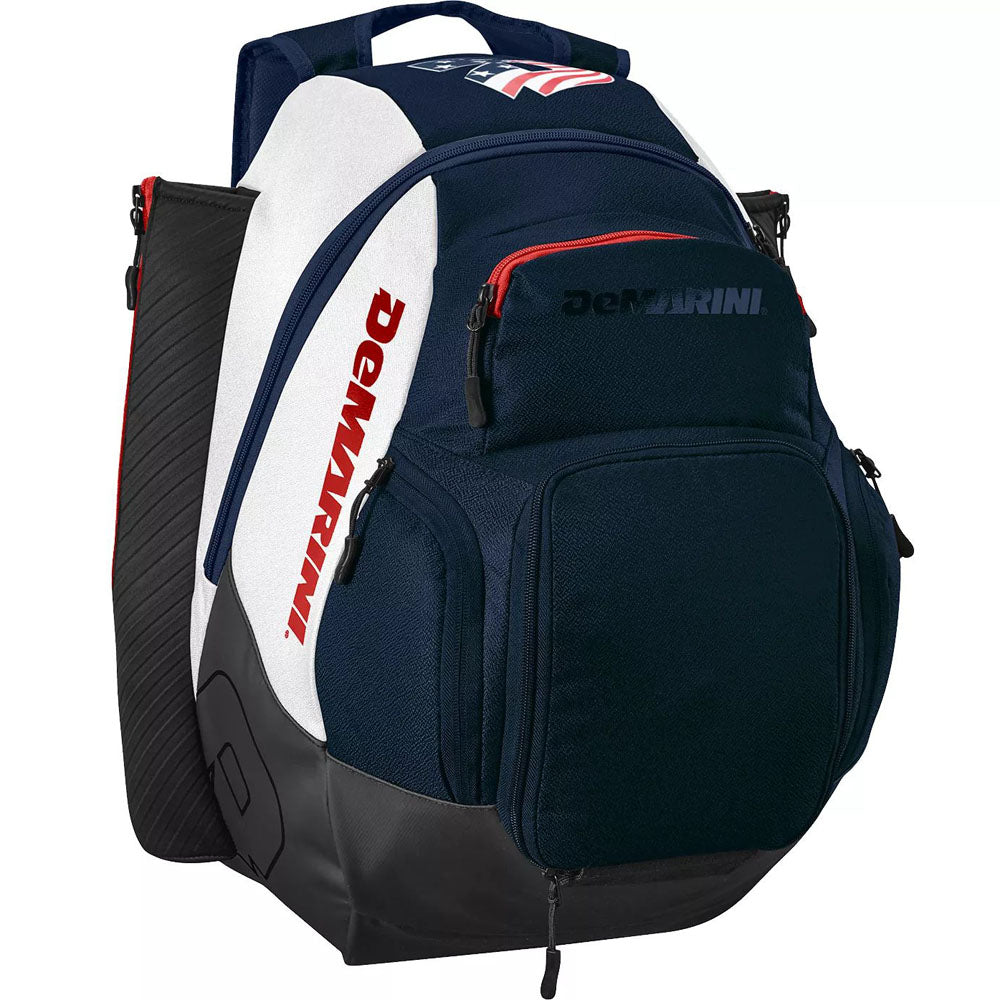 The DeMarini Voodoo OG Backpack: WB57117 is a navy blue, white, and black baseball backpack with red accents, multiple zippered compartments, side bat sleeves, and a sturdy bottom.