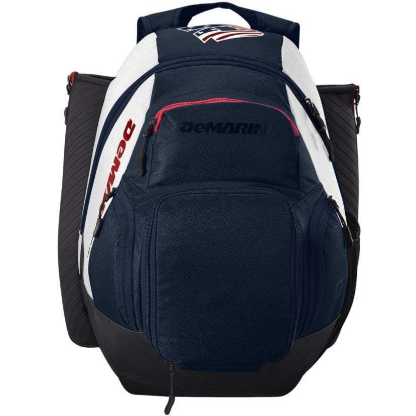 The DeMarini Voodoo OG Backpack: WB57117 is a navy blue, black, and white baseball backpack from DeMarini featuring multiple zippered compartments, side bat holders, and a red accent on the front pocket.