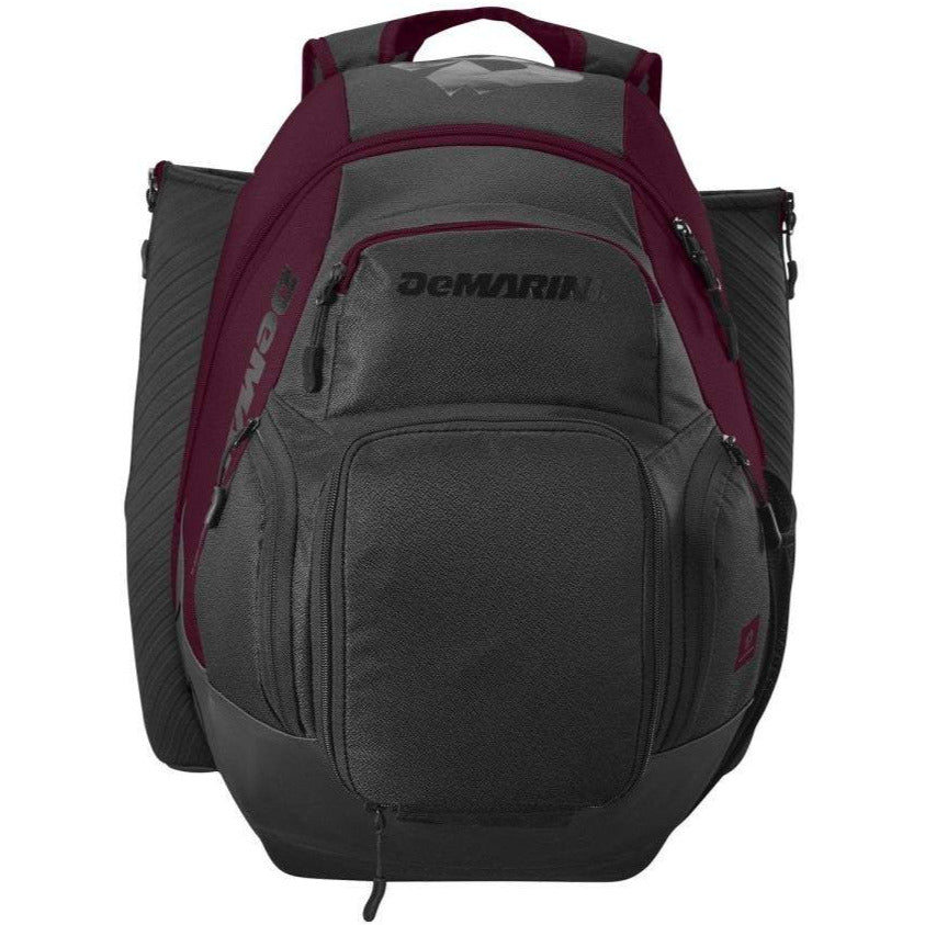 The DeMarini Voodoo OG Backpack: WB57117 is a dark gray and maroon baseball backpack with multiple zippered compartments, shoulder straps, and a top handle—ideal for carrying sports equipment.