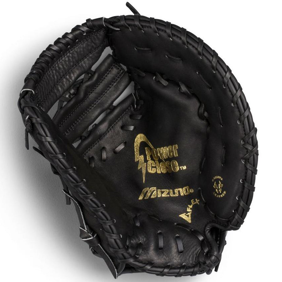 A Mizuno Prospect 12.5" Youth Baseball First Base Mitt (GXF102 / 312110) is shown open, revealing gold lettering, a deep pocket, and detailed stitching. The black Mizuno glove with PowerClose Technology rests on a white background.