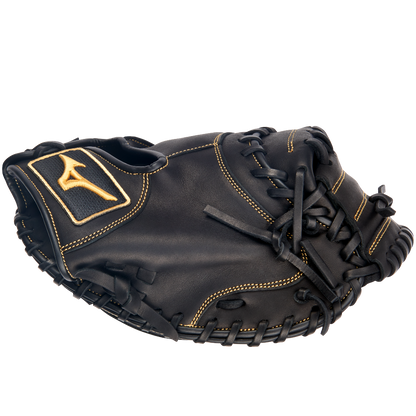 A Mizuno MVP Prime 34" GXC50PB4 catcher's mitt by Mizuno, crafted from Bio Soft Leather in black with tan stitching and a yellow logo patch on the wrist, is displayed against a plain white background.