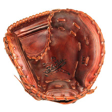 A worn brown leather Shoeless Joe 32" Fastpitch Catcher's Mitt (3200FPCM) with visible lacing and a logo featuring a player and the word “Shoeless,” designed in classic softball catcher’s mitt style.