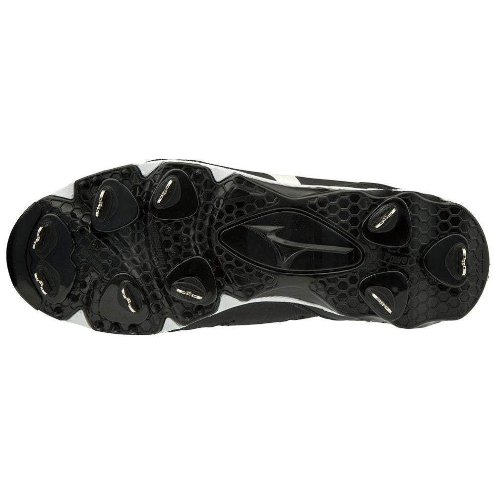 The image displays the black sole of the Mizuno 9-Spike Swift 6 Women's Low Metal Fastpitch Softball Cleat (model 320588), featuring six metal studs, a textured surface, and central logo for enhanced grip and traction.