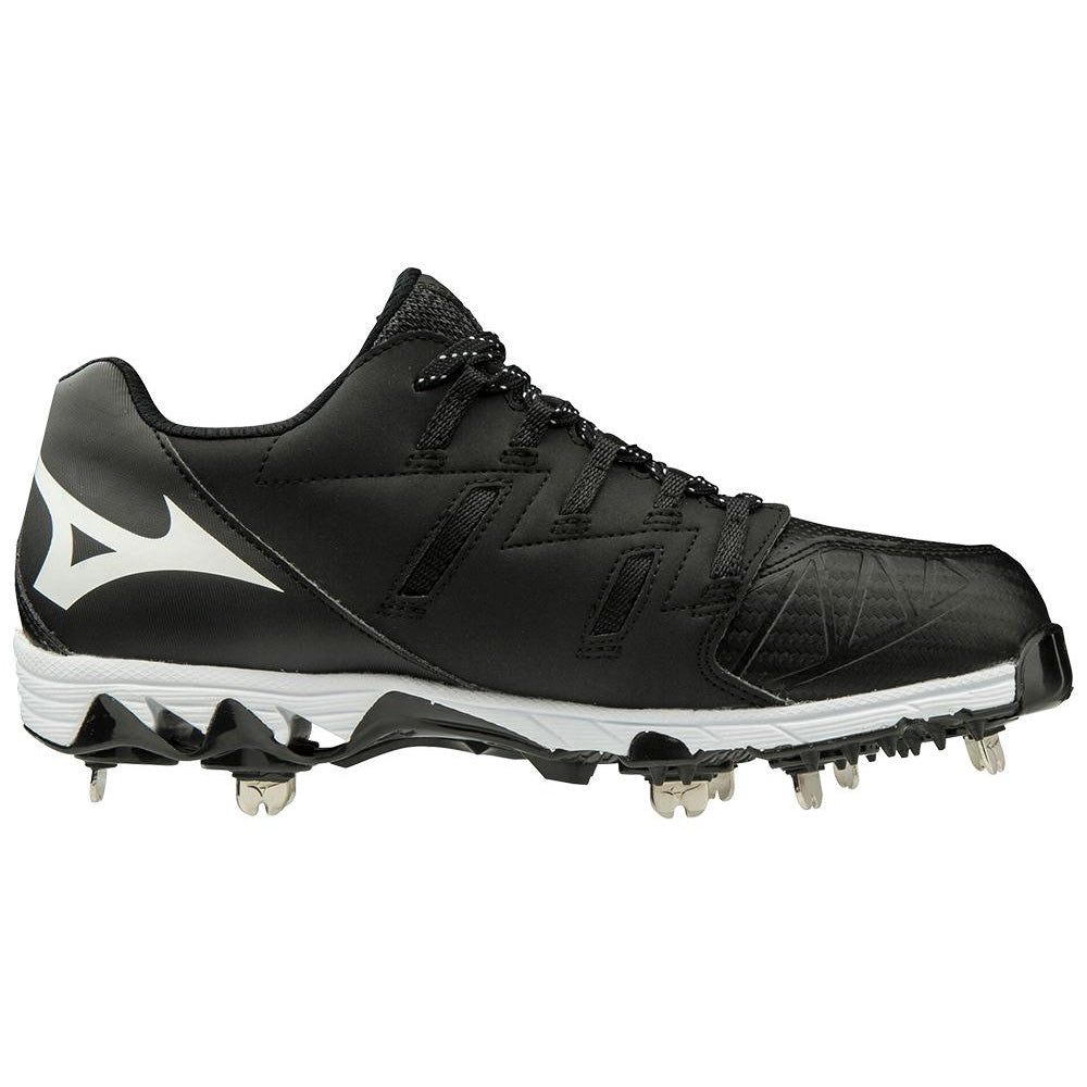 The Mizuno 9-Spike Swift 6 Women's Low Metal Fastpitch Softball Cleat (320588) is shown in black with white accents and metal spikes on the sole, displayed side view against a white background.