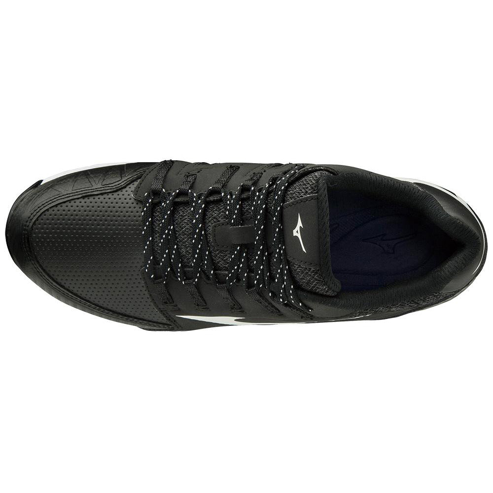 A top view of the Mizuno 9-Spike Swift 6 Women's Low Metal Fastpitch Softball Cleats by Mizuno, featuring a black design with white-speckled laces, a white logo on the tongue, perforated toe area, and cushioned black interior for softball players.