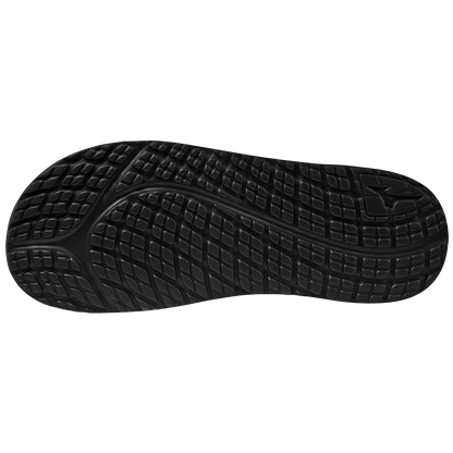 The image shows the Mizuno Relax Slide 2 Adult Slides (320629) by Mizuno, featuring a black rubber outsole with textured, grid-like tread and curved grooves for grip, plus a cushioned EVA midsole for comfort and support.