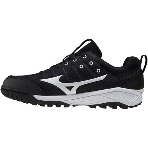 The Mizuno Ambition 2 All Surface Low Men's Turf Shoes (320632) feature a black design with white sole and large white logo, black laces, and a rugged outsole for superior traction—ideal for multi-sport use.