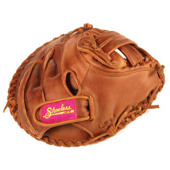 A brown leather Shoeless Joe 34" Fastpitch Catcher's Mitt (3400FPCM) features visible stitching and a red and yellow Shoeless label on the adjustable wrist strap, displayed against a white background.