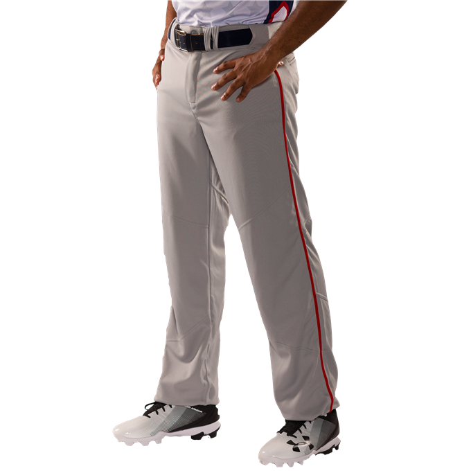 A person wears Alleson Adult Crush Open Bottom Baseball Pants with Piping (655WLB) in light gray with a red stripe, along with a black belt, white patterned shirt, and white cleats with black accents, standing against a white background.