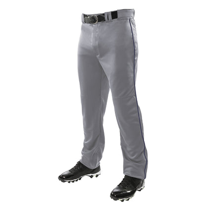 A person wearing Champro Sports Triple Crown Open Bottom Baseball Pants with Piping (BP91UA), paired with a black belt and black cleats, stands against a white background.