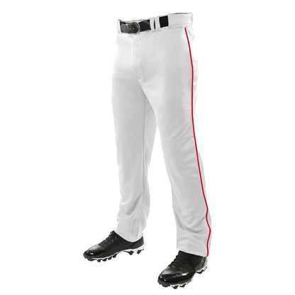 A person wearing Champro Sports Champro Youth Triple Crown Open Bottom Baseball Pants with Piping (BP91UY), featuring double knit polyester and a red stripe, plus a black belt and cleats, stands against a white background.