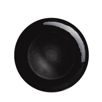 A round, glossy black plate features a subtle circular center pattern and a reflective white streak near the rim—reminiscent of the finish on the Louisville Slugger MLB Prime Signature Series CY22 Christian Yelich Game Model Bat—set against white.