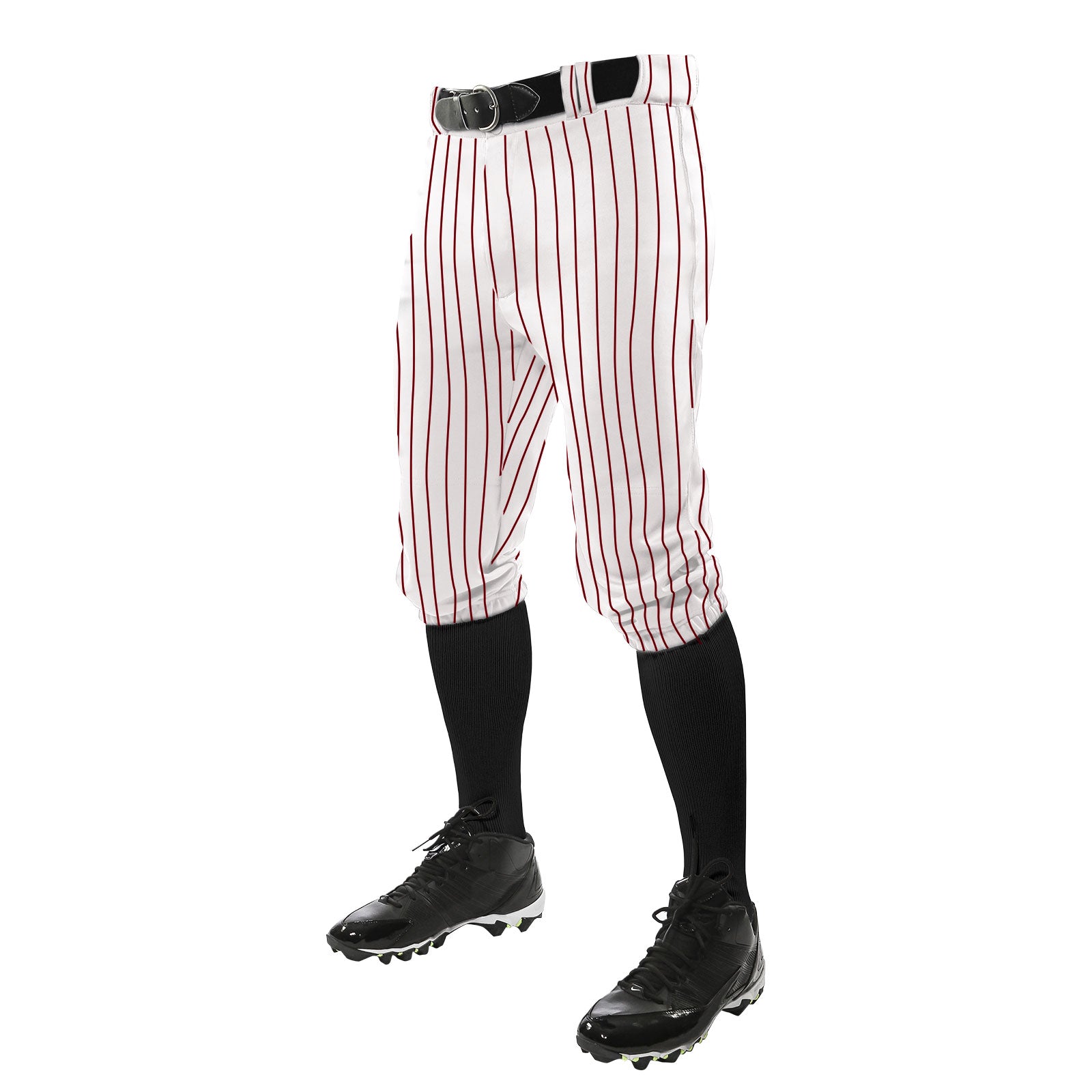 A person wears Champro Sports Triple Crown Pinstripe Knicker Baseball Pants (BPPINKA) in white with red stripes, a black belt, black knee-high socks, and black cleats, standing against a white background; upper body not visible.