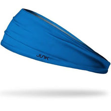 The Junk Blue Lagoon Headband by Junk is made from sweat-wicking technical t-shirt fabric, features "JUNK" in black letters, and is shown on a white background with a subtle shadow.