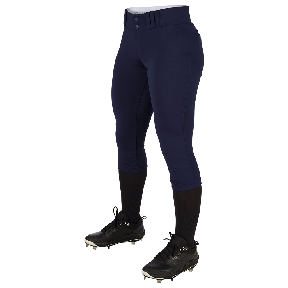 A person wears Champro Sports Women's Low Rise Tournament Fastpitch Softball Pants (BP11W) in navy, paired with black knee-high socks and cleats, shown waist down against a plain white background.