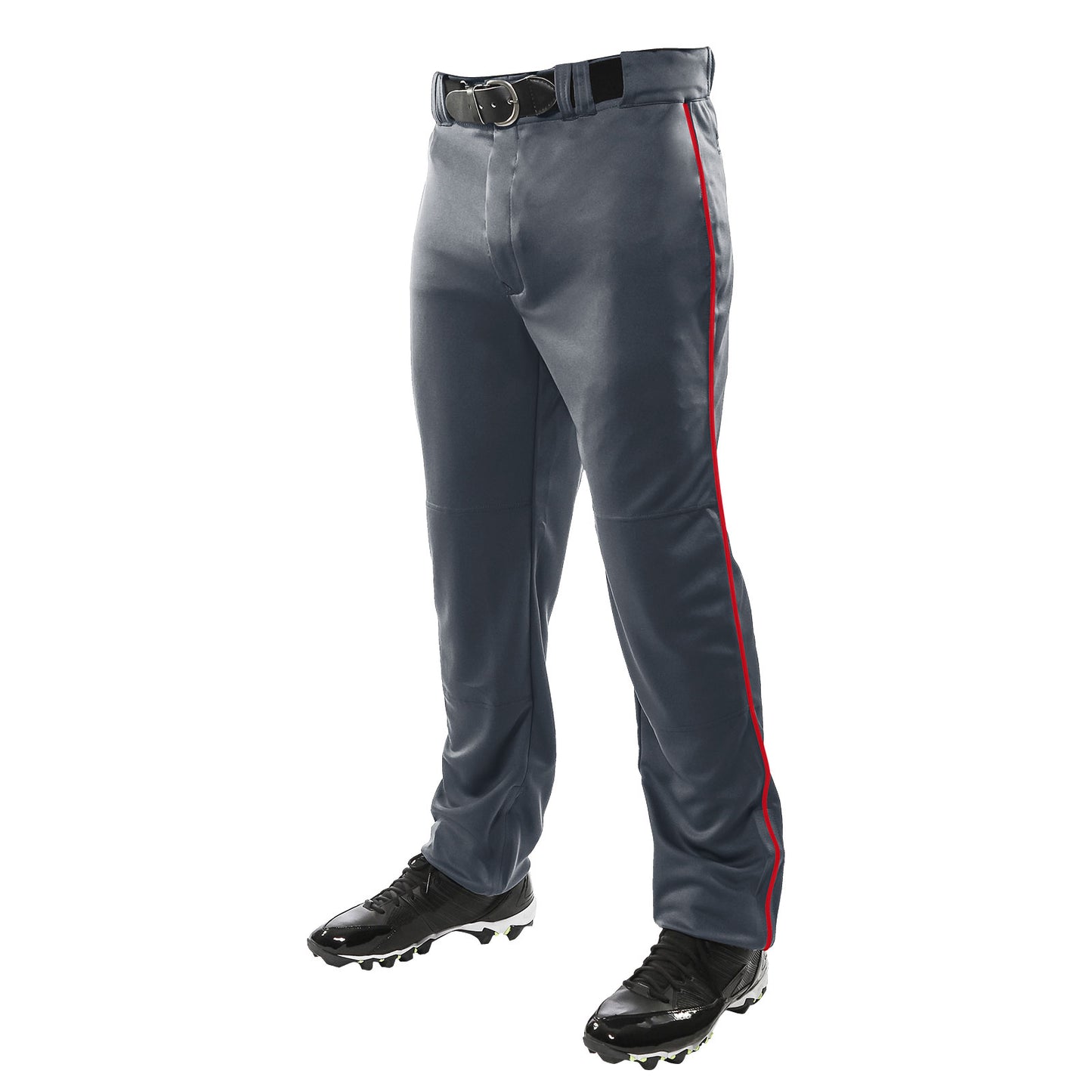 A person stands against a white background wearing Champro Sports Youth Triple Crown Open Bottom Baseball Pants with red piping (BP91UY), made from double knit polyester, paired with a black belt and black cleats.