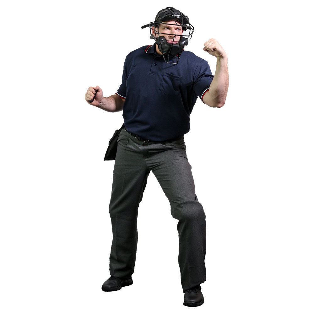 A baseball umpire outfitted in the Champro Sports Umpire Starter Kit (Set of 6): CBSUSK stands on a plain white background, one fist clenched and other arm flexed, making a dramatic call in Champro Sports gear.